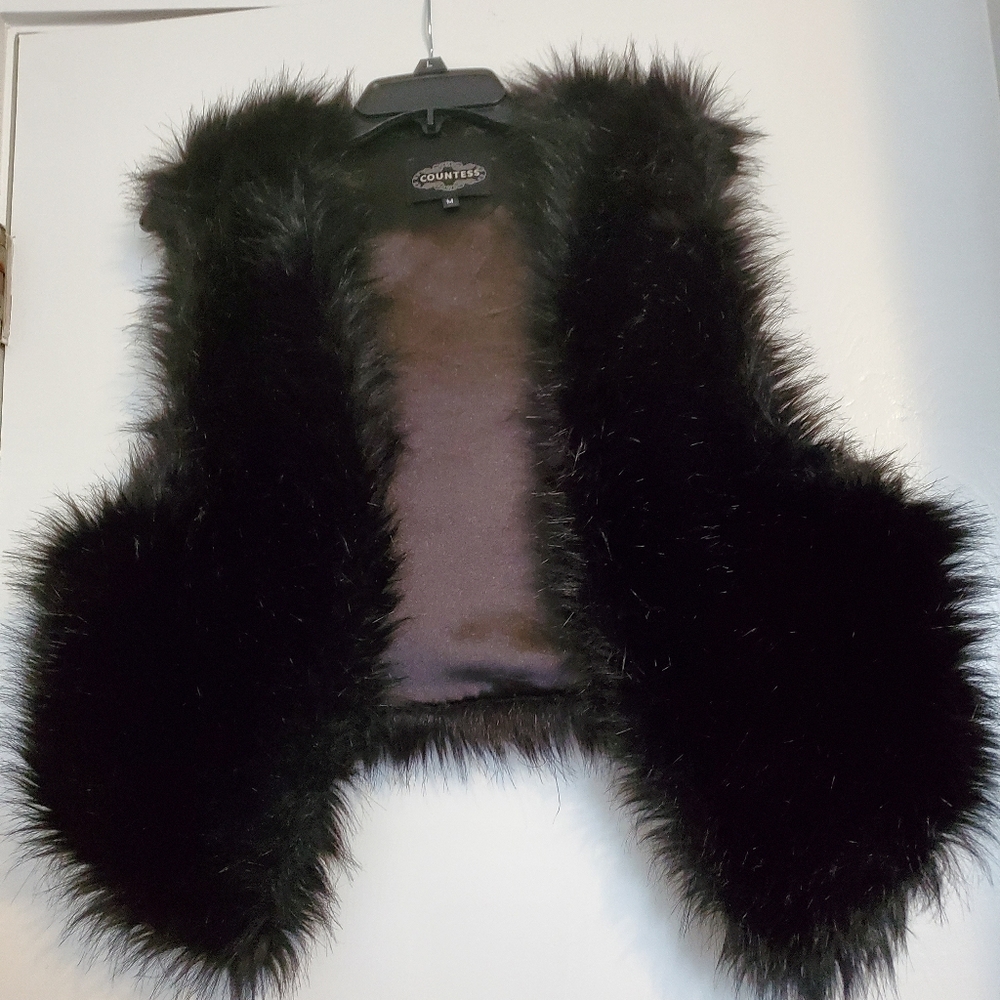Black faux fur vest.